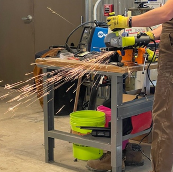 Team Member Cutting Steel