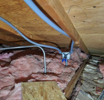 Electrical conduit and junction box in attic