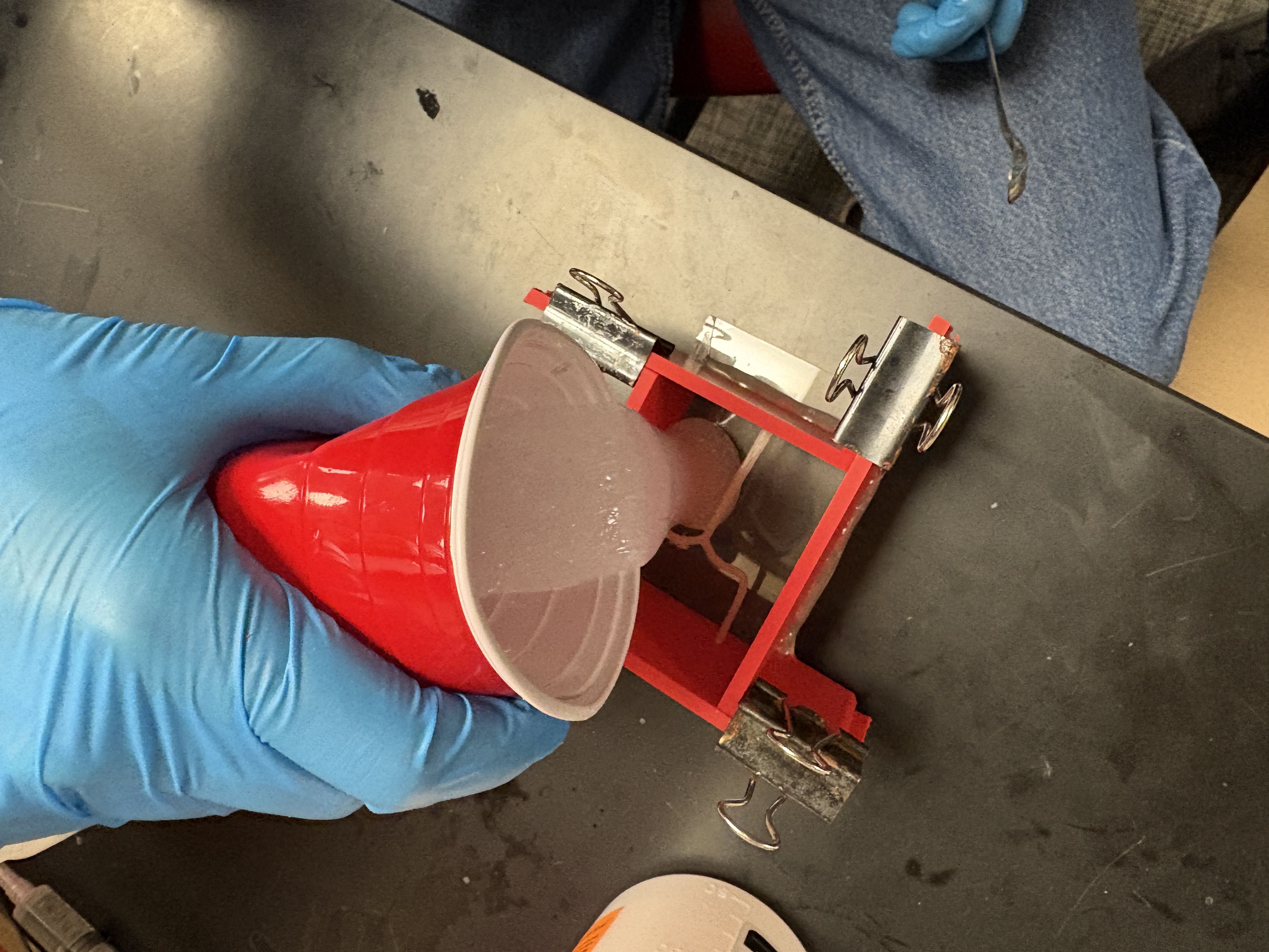 Pouring material into mold